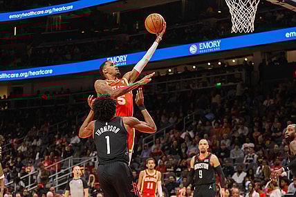 Feb 10, 2024; Atlanta, Georgia, USA; Atlanta Hawks guard Dejounte Murray (5) shoots against the Houston Rockets in the second quarter at State Farm Arena. Mandatory Credit: Brett Davis-USA TODAY Sports