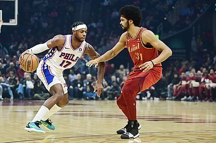 Feb 12, 2024; Cleveland, Ohio, USA; Philadelphia 76ers guard Buddy Hield (17) drives to the basket against Cleveland Cavaliers center Jarrett Allen (31) during the first half at Rocket Mortgage FieldHouse. Mandatory Credit: Ken Blaze-USA TODAY Sports