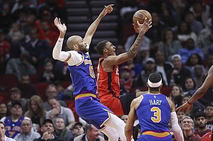 Feb 12, 2024; Houston, Texas, USA; Houston Rockets forward Jabari Smith Jr. (10) grabs a rebound away from New York Knicks forward Taj Gibson (67) during the second quarter at Toyota Center. Mandatory Credit: Troy Taormina-USA TODAY Sports