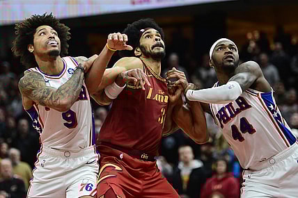 Feb 12, 2024; Cleveland, Ohio, USA; Cleveland Cavaliers center Jarrett Allen (31) fights for position against Philadelphia 76ers guard Kelly Oubre Jr. (9) and forward Paul Reed (44) during the second half at Rocket Mortgage FieldHouse. Mandatory Credit: Ken Blaze-USA TODAY Sports