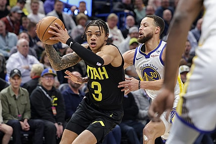 Feb 12, 2024; Salt Lake City, Utah, USA;  Utah Jazz guard Keyonte George (3) tries to get away from Golden State Warriors guard Stephen Curry (30) during the first quarter at Delta Center. Mandatory Credit: Chris Nicoll-USA TODAY Sports