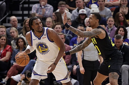 Feb 12, 2024; Salt Lake City, Utah, USA;  Golden State Warriors forward Kevon Looney (5) controls the ball from Utah Jazz forward John Collins (20) during the first quarter at Delta Center. Mandatory Credit: Chris Nicoll-USA TODAY Sports