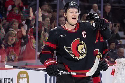 Feb 13, 2024; Ottawa, Ontario, CAN; Ottawa Senators left wing Brady Tkachuk (7) celebrates his goal scored in the first period against the Columbus Blue Jackets at the Canadian Tire Centre. Mandatory Credit: Marc DesRosiers-USA TODAY Sports