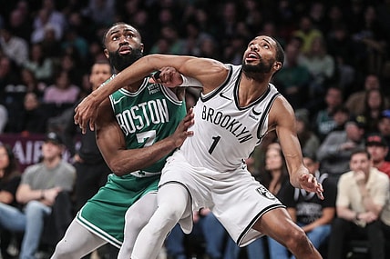 Feb 13, 2024; Brooklyn, New York, USA;  Boston Celtics guard Jaylen Brown (7) and Brooklyn Nets forward Mikal Bridges (1) box out for a rebound in the second quarter at Barclays Center. Mandatory Credit: Wendell Cruz-USA TODAY Sports