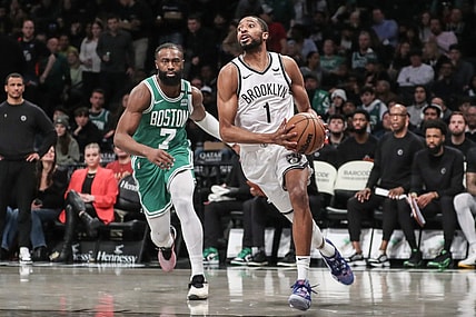 Feb 13, 2024; Brooklyn, New York, USA;  Brooklyn Nets forward Mikal Bridges (1) drives past Boston Celtics guard Jaylen Brown (7) in the third quarter at Barclays Center. Mandatory Credit: Wendell Cruz-USA TODAY Sports