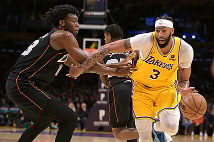 Feb 13, 2024; Los Angeles, California, USA;  Los Angeles Lakers forward Anthony Davis (3) is defended by Detroit Pistons center James Wiseman (13) in the first half at Crypto.com Arena. Mandatory Credit: Jayne Kamin-Oncea-USA TODAY Sports