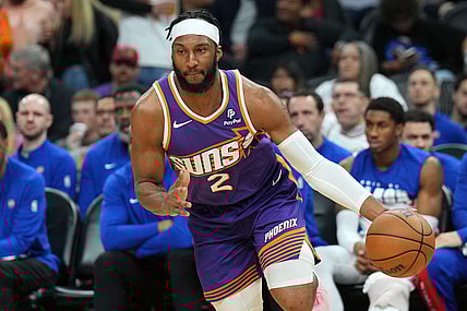 Feb 14, 2024; Phoenix, Arizona, USA; Phoenix Suns forward Josh Okogie (2) dribbles against the Detroit Pistons during the first half at Footprint Center. Mandatory Credit: Joe Camporeale-USA TODAY Sports