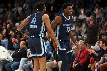 Feb 14, 2024; Memphis, Tennessee, USA; Memphis Grizzlies forward-center Jaren Jackson Jr. (13) reacts with guard Jordan Goodwin(4) after a three-point basket during the second half against the Houston Rockets at FedExForum. Mandatory Credit: Petre Thomas-USA TODAY Sports