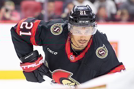 Feb 15, 2024; Ottawa, Ontario, CAN; Ottawa Senators right wing Mathieu Joseph (21) sets up for a face off in the first period  against the Anaheim Ducks at the Canadian Tire Centre. Mandatory Credit: Marc DesRosiers-USA TODAY Sports