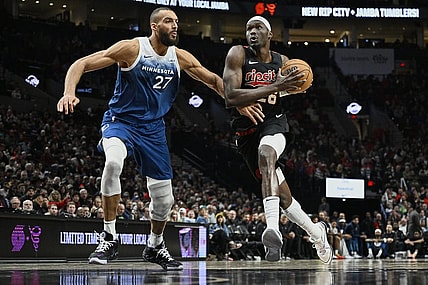 Feb 15, 2024; Portland, Oregon, USA; Portland Trail Blazers center Duop Reath (26) drives to the basket during the second half against Minnesota Timberwolves center Rudy Gobert (27) at Moda Center. Mandatory Credit: Troy Wayrynen-USA TODAY Sports
