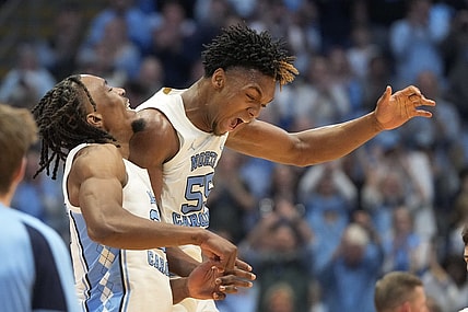 Feb 17, 2024; Chapel Hill, North Carolina, USA; North Carolina Tar Heels forward Harrison Ingram (55) and forward Jae'Lyn Withers (24) celebrate in the first half at Dean E. Smith Center. Mandatory Credit: Bob Donnan-USA TODAY Sports
