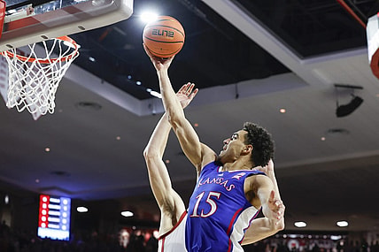 Feb 17, 2024; Norman, Oklahoma, USA; Kansas Jayhawks guard Kevin McCullar Jr. (15) goes to the basket against the Oklahoma Sooners during the first half at Lloyd Noble Center. Mandatory Credit: Alonzo Adams-USA TODAY Sports