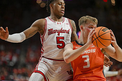 Feb 17, 2024; College Park, Maryland, USA;  Illinois Fighting Illini forward Marcus Domask (3) looks to pass as Maryland Terrapins guard DeShawn Harris-Smith (5) defends during the first  half at Xfinity Center. Mandatory Credit: Tommy Gilligan-USA TODAY Sports