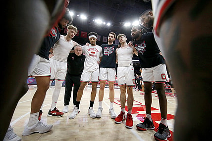 Feb 18, 2024; Columbus, Ohio, USA;  Ohio State Buckeyes guard Bowen Hardman (left) and guard Roddy Gayle Jr. (center) and forward Jamison Battle (center right) and guard Colby Baumann (42) huddle up before the game against the Purdue Boilermakers at Value City Arena. Mandatory Credit: Joseph Maiorana-USA TODAY Sports