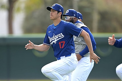 Feb 18, 2024; Glendale, AZ, USA;  Los Angeles Dodgers designated hitter Shohei Ohtani (17) stretches during spring training at Camelback Ranch. Mandatory Credit: Jayne Kamin-Oncea-USA TODAY Sports