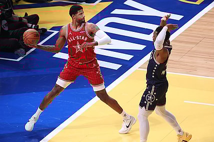 Feb 18, 2024; Indianapolis, Indiana, USA; Western Conference forward Paul George (13) of the LA Clippers attempts to save the ball against Eastern Conference guard Donovan Mitchell (45) of the Cleveland Cavaliers during the third quarter in the 73rd NBA All Star game at Gainbridge Fieldhouse. Mandatory Credit: Trevor Ruszkowski-USA TODAY Sports