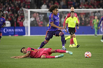 Feb 20, 2024; St. Louis, MO, USA; Houston Dynamo midfielder Adalberto Carrasquilla (20) dribbles past St. Louis City defender Anthony Markanich (13) during the first half of the CONCACAF Champions Cup-Round One at CITYPARK. Mandatory Credit: Joe Puetz-USA TODAY Sports