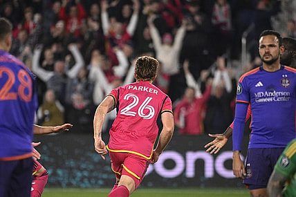 Feb 20, 2024; St. Louis, MO, USA; St. Louis City defender Tim Parker (26) reacts after scoring a goal against the Houston Dynamo during the second half of the CONCACAF Champions Cup-Round One at CITYPARK. Mandatory Credit: Joe Puetz-USA TODAY Sports