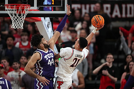 Feb 20, 2024; Lubbock, Texas, USA;  Texas Tech Red Raiders forward KyeRon Lindsey (21) shoots against TCU Horned Frogs forward Essam Mostafa (44) in the first half at United Supermarkets Arena. Mandatory Credit: Michael C. Johnson-USA TODAY Sports