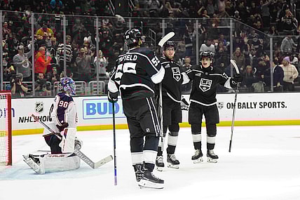 Feb 20, 2024; Los Angeles, California, USA; LA Kings center Pierre-Luc Dubois (80) celebrates after scoring a goal with right wing Quinton Byfield (55) and center Alex Turcotte (38) as Columbus Blue Jackets goaltender Elvis Merzlikins (90) reacts  in the second period at Crypto.com Arena. Mandatory Credit: Kirby Lee-USA TODAY Sports
