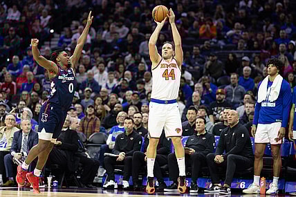 Feb 22, 2024; Philadelphia, Pennsylvania, USA; New York Knicks forward Bojan Bogdanovic (44) scores a three pointer in front of Philadelphia 76ers guard Tyrese Maxey (0) during the second quarter at Wells Fargo Center. Mandatory Credit: Bill Streicher-USA TODAY Sports