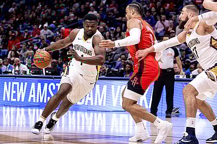Feb 22, 2024; New Orleans, Louisiana, USA;  New Orleans Pelicans forward Zion Williamson (1) dribbles against Houston Rockets forward Dillon Brooks (9) during the first half at Smoothie King Center. Mandatory Credit: Stephen Lew-USA TODAY Sports