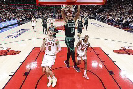 Feb 22, 2024; Chicago, Illinois, USA; Boston Celtics guard Derrick White (9) dunks the ball against the Chicago Bulls during the first half at United Center. Mandatory Credit: Kamil Krzaczynski-USA TODAY Sports