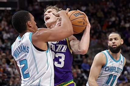 Feb 22, 2024; Salt Lake City, Utah, USA;  Utah Jazz forward Lauri Markkanen (23) is fouled by Charlotte Hornets forward Grant Williams (2) during the second quarter at Delta Center. Mandatory Credit: Chris Nicoll-USA TODAY Sports