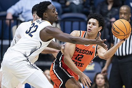 February 22, 2024; Berkeley, California, USA; Oregon State Beavers forward Michael Rataj (12) passes the basketball against California Golden Bears guard Jalen Celestine (32) during the first half at Haas Pavilion. Mandatory Credit: Kyle Terada-USA TODAY Sports