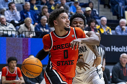 February 22, 2024; Berkeley, California, USA; Oregon State Beavers guard Jordan Pope (0) dribbles the basketball against California Golden Bears guard Jalen Cone (15) during the second half at Haas Pavilion. Mandatory Credit: Kyle Terada-USA TODAY Sports