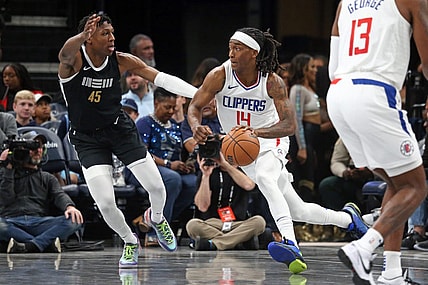 Feb 23, 2024; Memphis, Tennessee, USA; Los Angeles Clippers guard Terance Mann (14) drives to the basket as Memphis Grizzlies forward GG Jackson (45) defends during the first half at FedExForum. Mandatory Credit: Petre Thomas-USA TODAY Sports