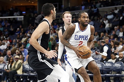 Feb 23, 2024; Memphis, Tennessee, USA; Los Angeles Clippers forward Kawhi Leonard (2) drives to the basket as Memphis Grizzlies forward-center Santi Aldama (7) defends during the second half at FedExForum. Mandatory Credit: Petre Thomas-USA TODAY Sports