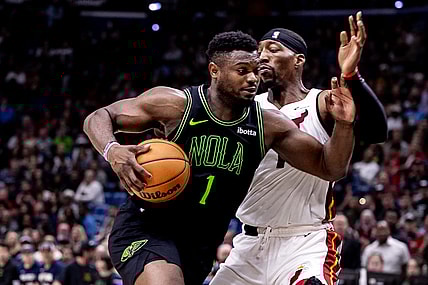 Feb 23, 2024; New Orleans, Louisiana, USA;  New Orleans Pelicans forward Zion Williamson (1) drives to the basket against Miami Heat center Bam Adebayo (13) during the second half at Smoothie King Center. Mandatory Credit: Stephen Lew-USA TODAY Sports
