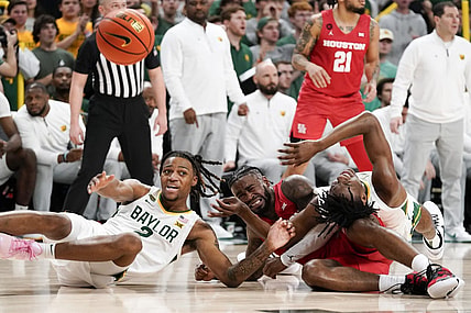 Feb 24, 2024; Waco, Texas, USA; Baylor Bears guard Jayden Nunn (2) and Baylor Bears guard Ja'Kobe Walter (4) battle with Houston Cougars guard Jamal Shead (1) for the loose ball during the first half at Paul and Alejandra Foster Pavilion. Mandatory Credit: Raymond Carlin III-USA TODAY Sports