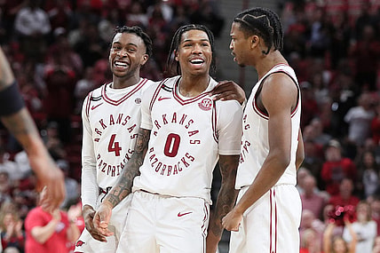 Feb 24, 2024; Fayetteville, Arkansas, USA; Arkansas Razorbacks guard Khalif Battle (0) celebrates with guards Davonte Davis (4) and Tramon Mark (12) after making a three point shot in the second half against the Missouri Tigers at Bud Walton Arena. Arkansas won 88-73. Mandatory Credit: Nelson Chenault-USA TODAY Sports