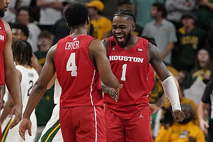 Feb 24, 2024; Waco, Texas, USA; Houston Cougars guard L.J. Cryer (4) and guard Jamal Shead (1) react in the closing moments of overtime against the Baylor Bears at Paul and Alejandra Foster Pavilion. Mandatory Credit: Raymond Carlin III-USA TODAY Sports