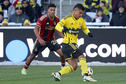 Feb 24, 2024; Columbus, Ohio, USA; Columbus Crew forward Cucho Hernandez (9) dribbles the ball past Atlanta United defender Caleb Wiley (26) during the first half at Lower.com Field. Mandatory Credit: Trevor Ruszkowski-USA TODAY Sports
