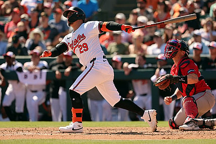 Feb 24, 2024; Sarasota, Florida, USA; Baltimore Orioles third baseman Ramon Urias (29) hits a sacrifice RBI during the fourth inning against the Boston Red Sox at Ed Smith Stadium. Mandatory Credit: Kim Klement Neitzel-USA TODAY Sports
