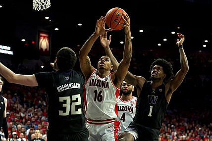 Feb 24, 2024; Tucson, Arizona, USA; Arizona Wildcats forward Keshad Johnson (16) gets a rebound against Washington Huskies forward Wilhelm Breidenbach (32) and forward Keion Brooks Jr. (1) during the second half at McKale Center. Mandatory Credit: Zachary BonDurant-USA TODAY Sports