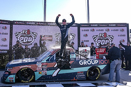Feb 24, 2024; Hampton, Georgia, USA; NASCAR Craftsman Truck Series Driver Kyle Busch celebrates in victory lane after winning the Fr8 208 at Atlanta Motor Speedway. Mandatory Credit: David Yeazell-USA TODAY Sports