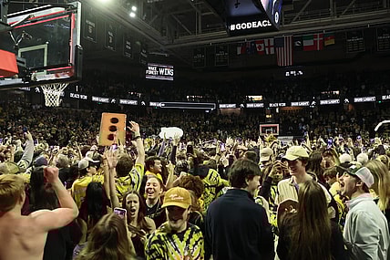 Feb 24, 2024; Winston-Salem, North Carolina, USA;  Wake Forest Demon Deacons students storm the court after Wake Forest wins at Lawrence Joel Veterans Memorial Coliseum. Mandatory Credit: Cory Knowlton-USA TODAY Sports