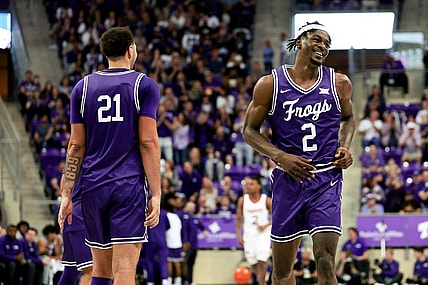 Feb 24, 2024; Fort Worth, Texas, USA; TCU Horned Frogs forward Emanuel Miller (2) celebrates with TCU Horned Frogs forward JaKobe Coles (21) during the second half against the Cincinnati Bearcats at Ed and Rae Schollmaier Arena. Mandatory Credit: Kevin Jairaj-USA TODAY Sports