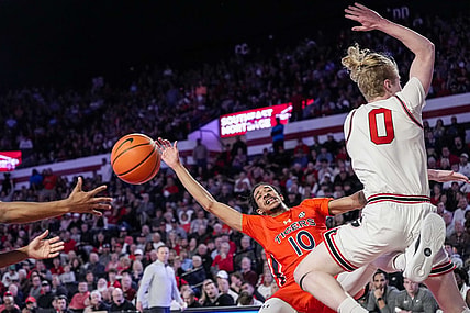 Feb 24, 2024; Athens, Georgia, USA; Auburn Tigers guard Chad Baker-Mazara (10) and Georgia Bulldogs guard Blue Cain (0) collide during the first half at Stegeman Coliseum. Mandatory Credit: Dale Zanine-USA TODAY Sports