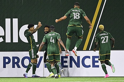 Feb 24, 2024; Portland, Oregon, USA; Portland Timbers forward Antony (11) celebrates with his teammates after scoring a goal against the Colorado Rapids at Providence Park. Mandatory Credit: Troy Wayrynen-USA TODAY Sports