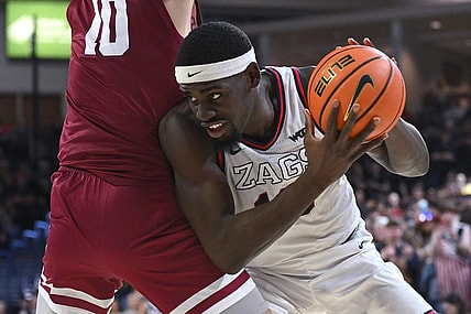 Feb 24, 2024; Spokane, Washington, USA; Gonzaga Bulldogs forward Graham Ike (13) fights for position against Santa Clara Broncos center Francisco Caffaro (10) in the second half at McCarthey Athletic Center. Gonzaga Bulldogs won 94-81. Mandatory Credit: James Snook-USA TODAY Sports