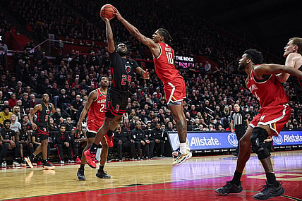 Feb 25, 2024; Piscataway, New Jersey, USA; Maryland Terrapins forward Julian Reese (10) blocks a shot by Rutgers Scarlet Knights guard Austin Williams (24) during the second half at Jersey Mike's Arena. Mandatory Credit: Vincent Carchietta-USA TODAY Sports