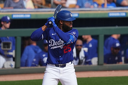 Feb 25, 2024; Phoenix, Arizona, USA; Los Angeles Dodgers designated hitter Manuel Margot (25) bats against the Oakland Athletics during the third inning at Camelback Ranch-Glendale. Mandatory Credit: Joe Camporeale-USA TODAY Sports