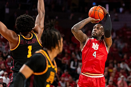 Feb 25, 2024; Lincoln, Nebraska, USA; Nebraska Cornhuskers forward Juwan Gary (4) shoots the ball against Minnesota Golden Gophers forward Joshua Ola-Joseph (1) and guard Elijah Hawkins (0) during the first half at Pinnacle Bank Arena. Mandatory Credit: Dylan Widger-USA TODAY Sports