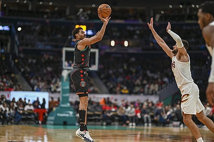 Feb 25, 2024; Washington, District of Columbia, USA;  Washington Wizards guard Jordan Poole (13) shoots over Cleveland Cavaliers forward Georges Niang (20) during the second  half at Capital One Arena. Mandatory Credit: Tommy Gilligan-USA TODAY Sports