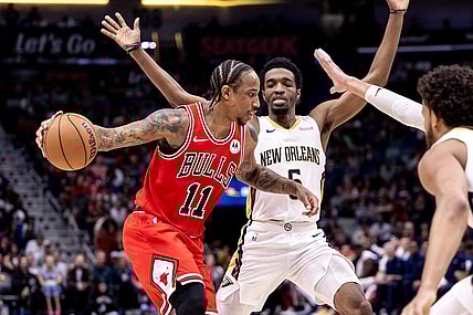 Feb 25, 2024; New Orleans, Louisiana, USA;  Chicago Bulls forward DeMar DeRozan (11) looks to pass the ball against New Orleans Pelicans forward Herbert Jones (5) during the second half at Smoothie King Center. Mandatory Credit: Stephen Lew-USA TODAY Sports